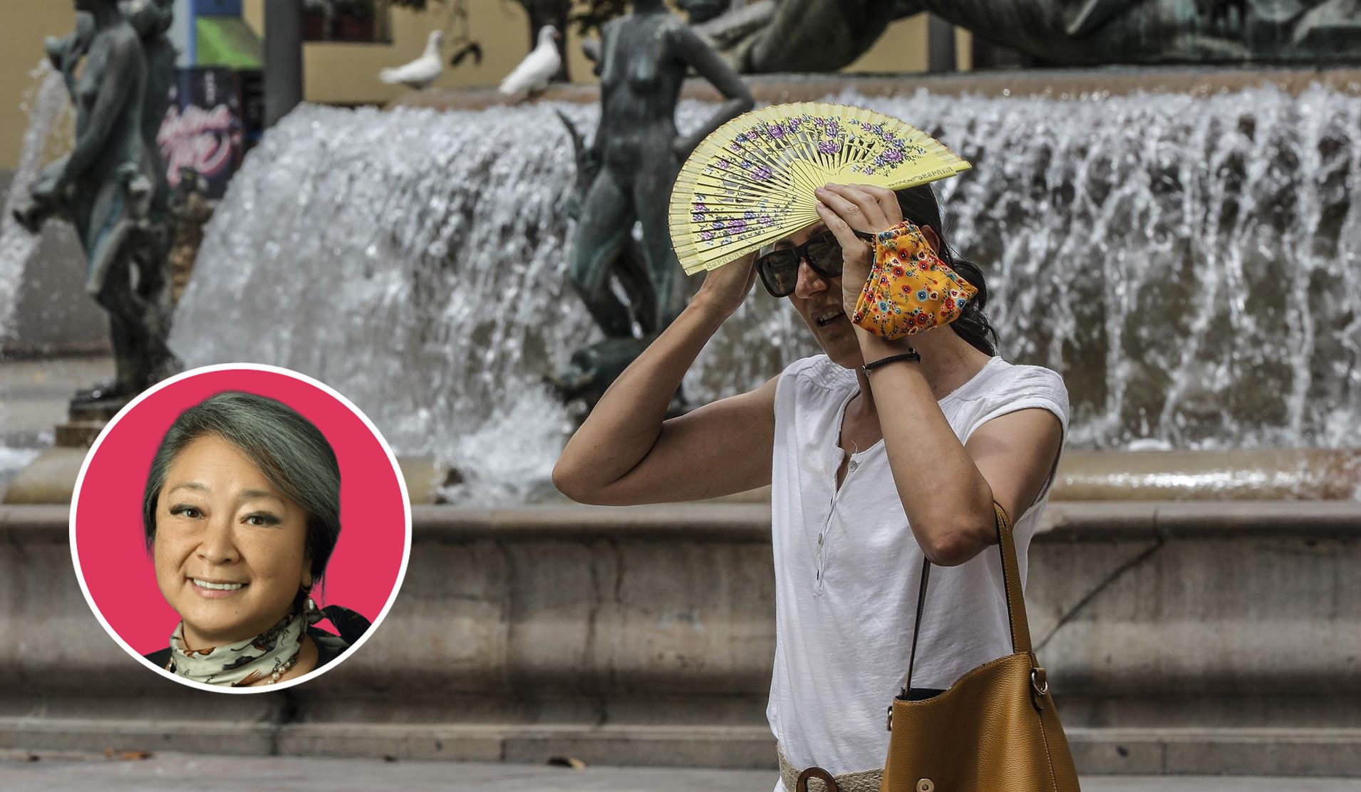 Una mujer se protege del sol en plena ola de calor
